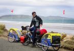 Cycling along Colac Bay South Island New Zealand
