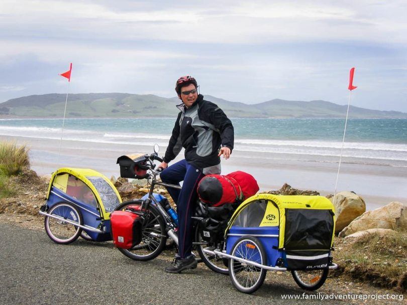 Cycling along Colac Bay South Island New Zealand