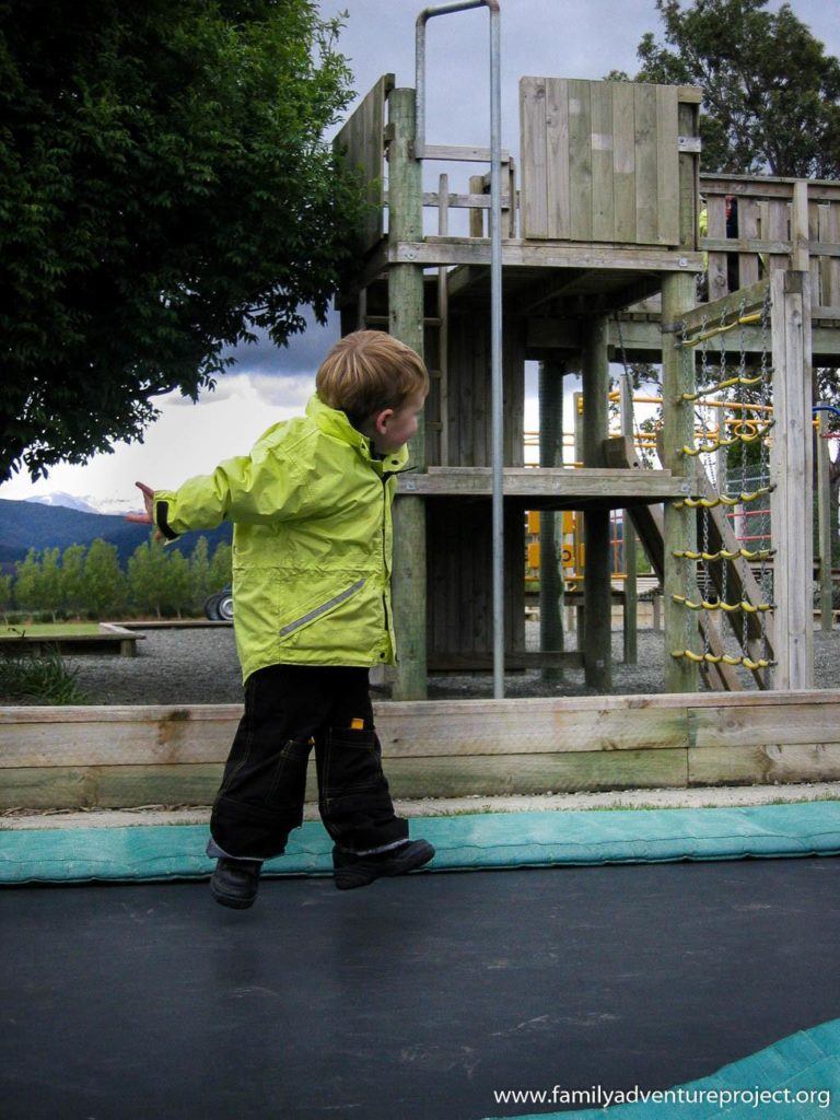 Playing on the trampoline in New Zealand playground at Blackmoun
