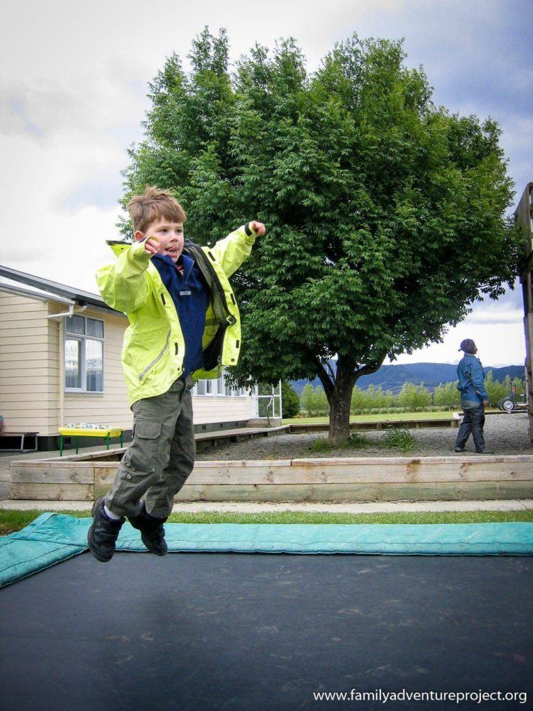 Bouncing on the trampoline in a playground in New Zealand