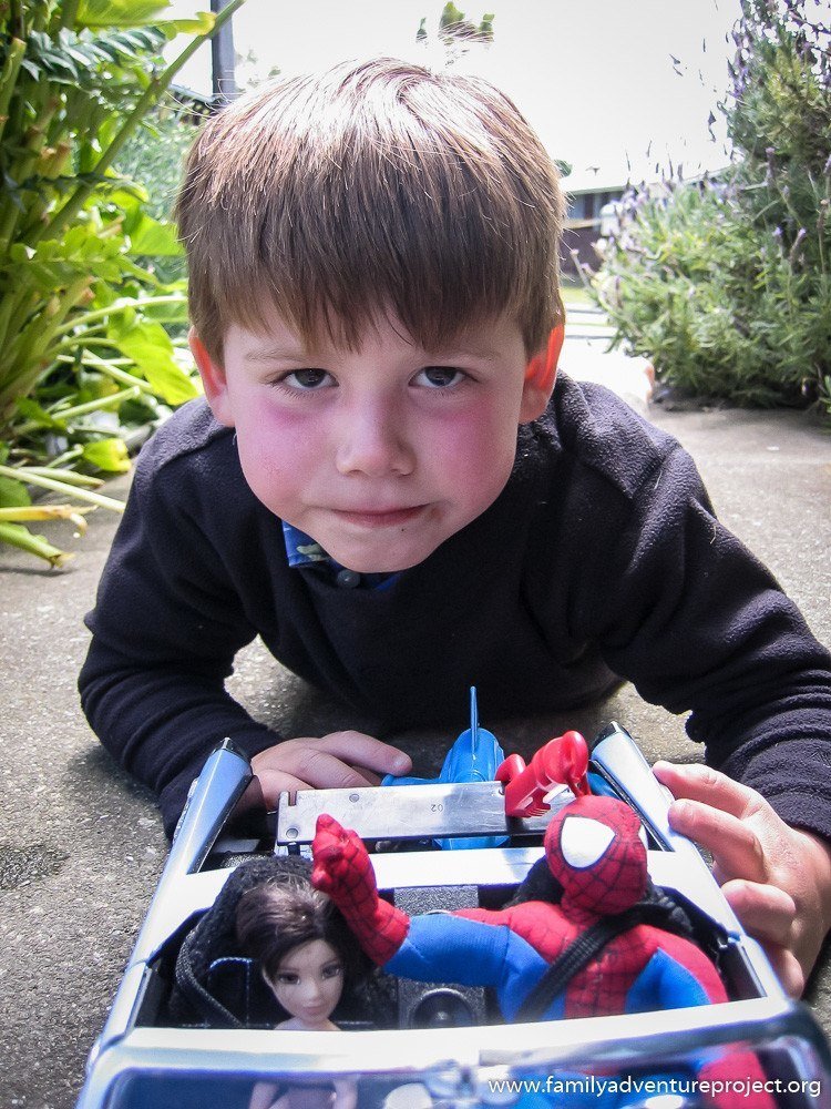 Playing with Spiderman and Barbie