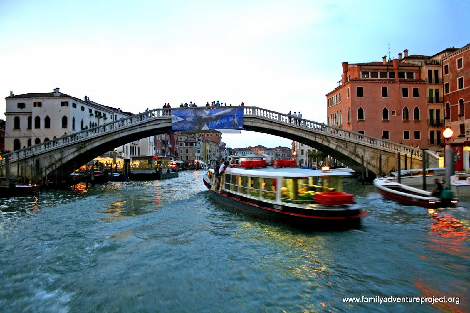 Vaporetto goes under Bridge of Sighs Venice