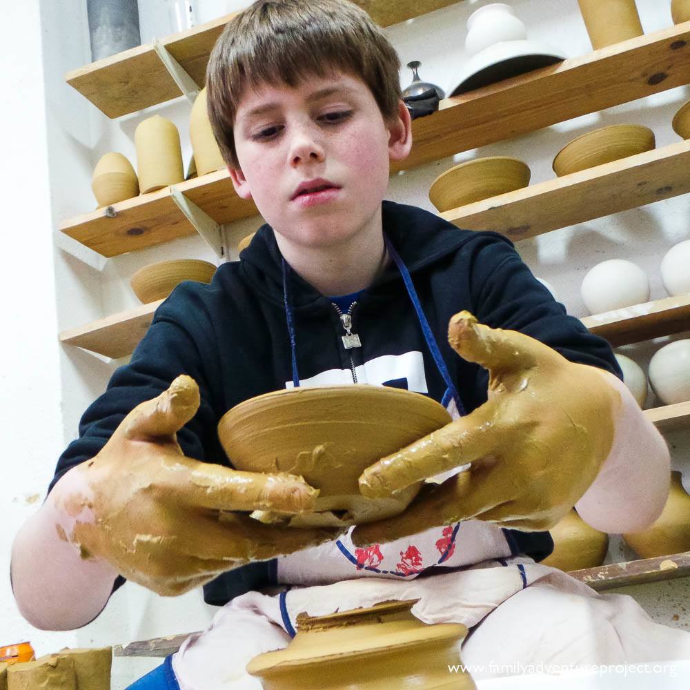 Boy learning pottery