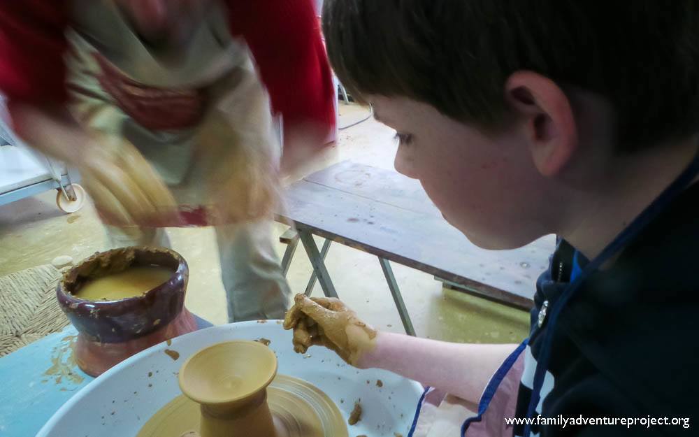Boy learning pottery