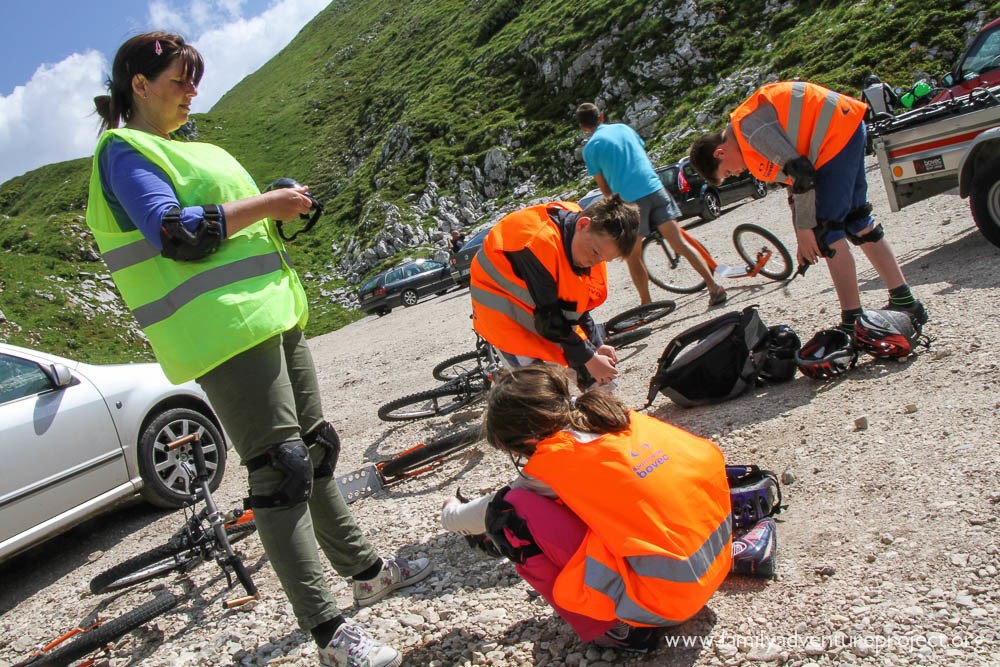 Getting geared up. Elbow and knee pads are de rigeur for this downhill scooting extravaganza 