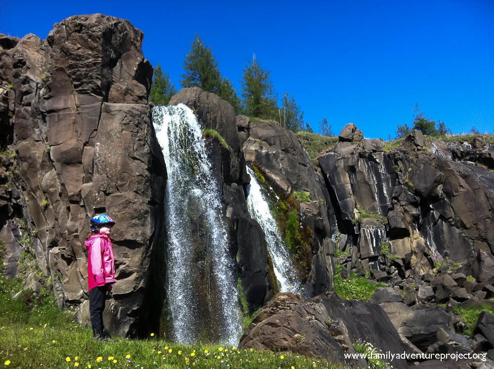 Girl by Waterfall in Iceland