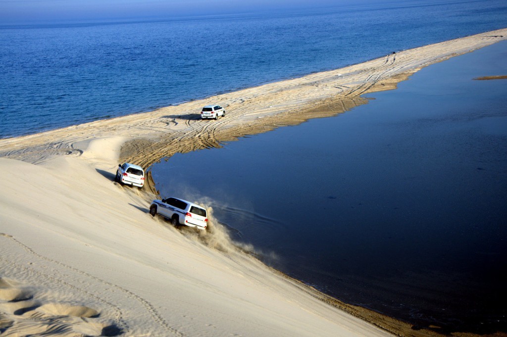 Driving on Sand Dunes at Inland Sea Qatar Driving on Sand Dunes at Inland Sea Qatar