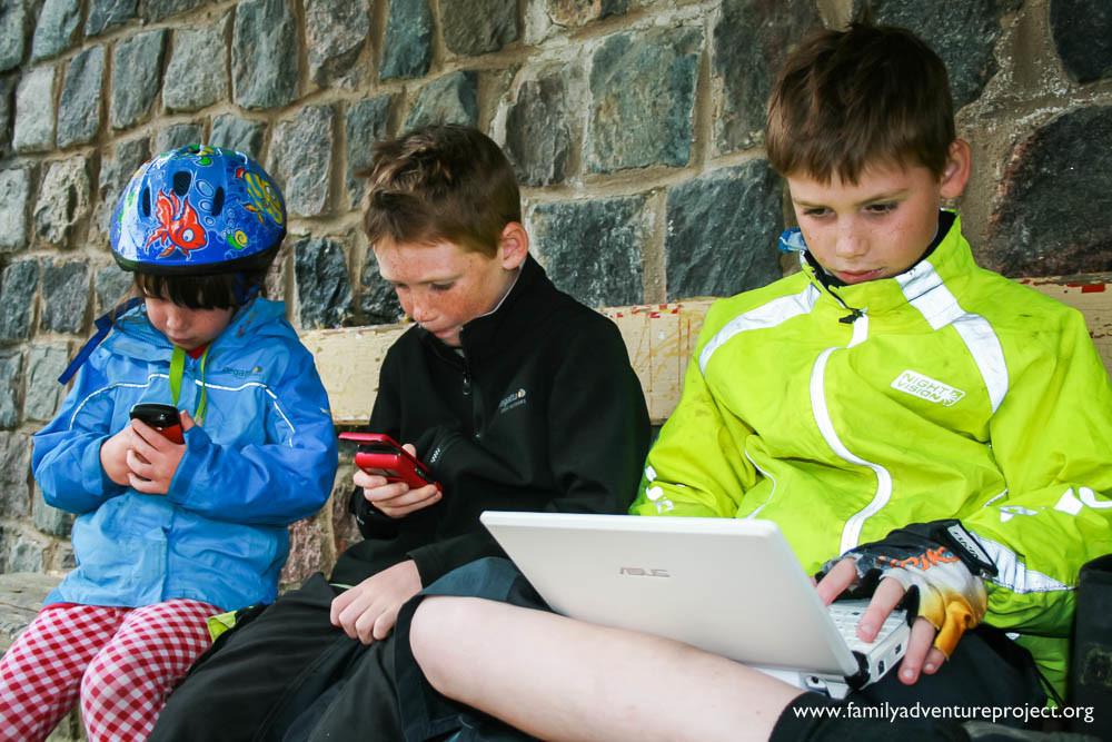 Kids using technology on the road