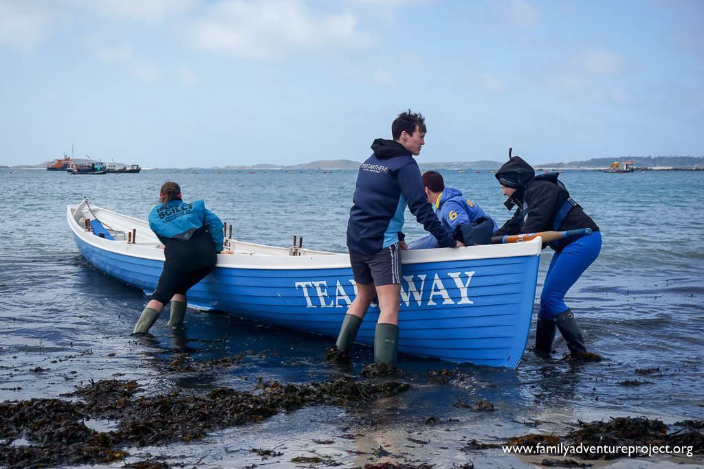 St Mary's Gig Club members putting Tearaway in the water