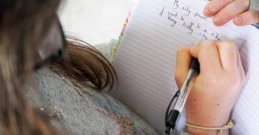 Child writing a city poem