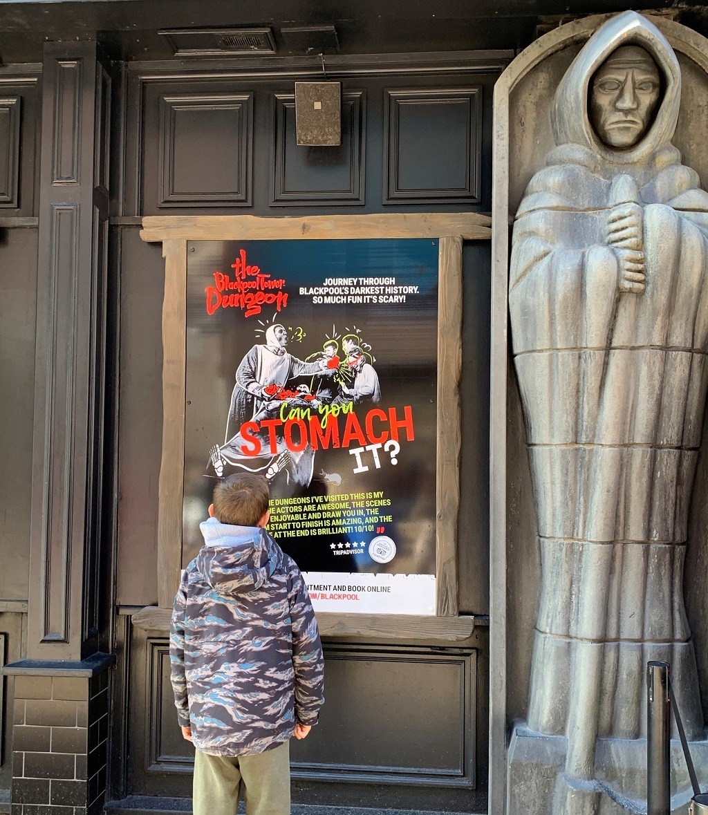 Boy outside Blackpool dungeon