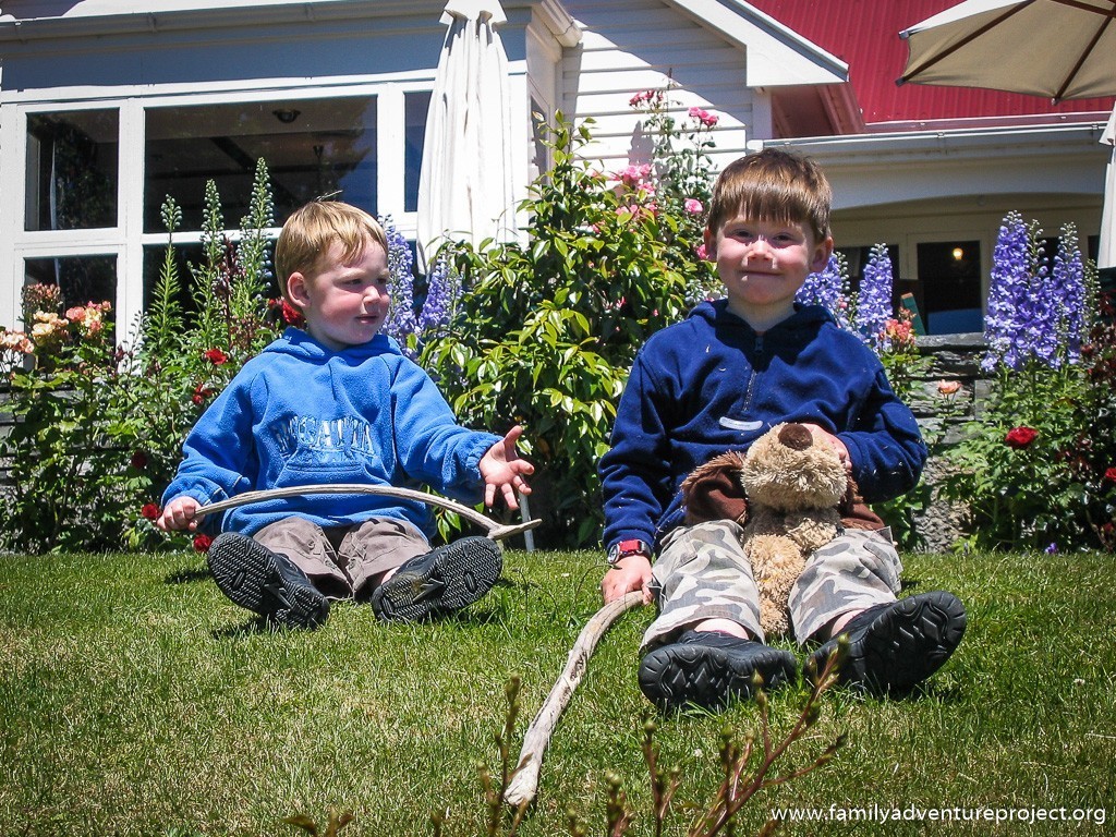 Puppy the Wuppy, Matthew and Cameron on the lawn at Walter Peak New Zealand