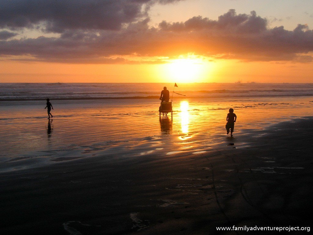 Cycling into the sunset on 90 mile beach