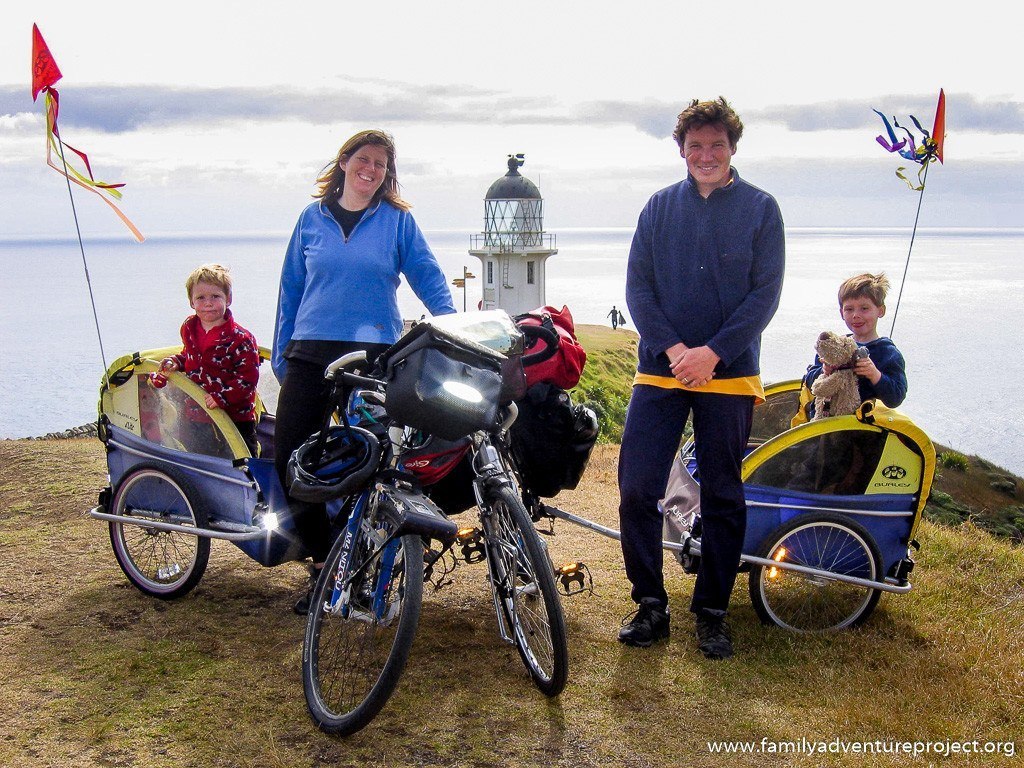 Cycling family arrives at Cape Reinga