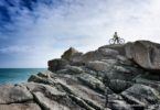 Cycling on Scilly. On the rocks at Old Town Bay, St Mary's