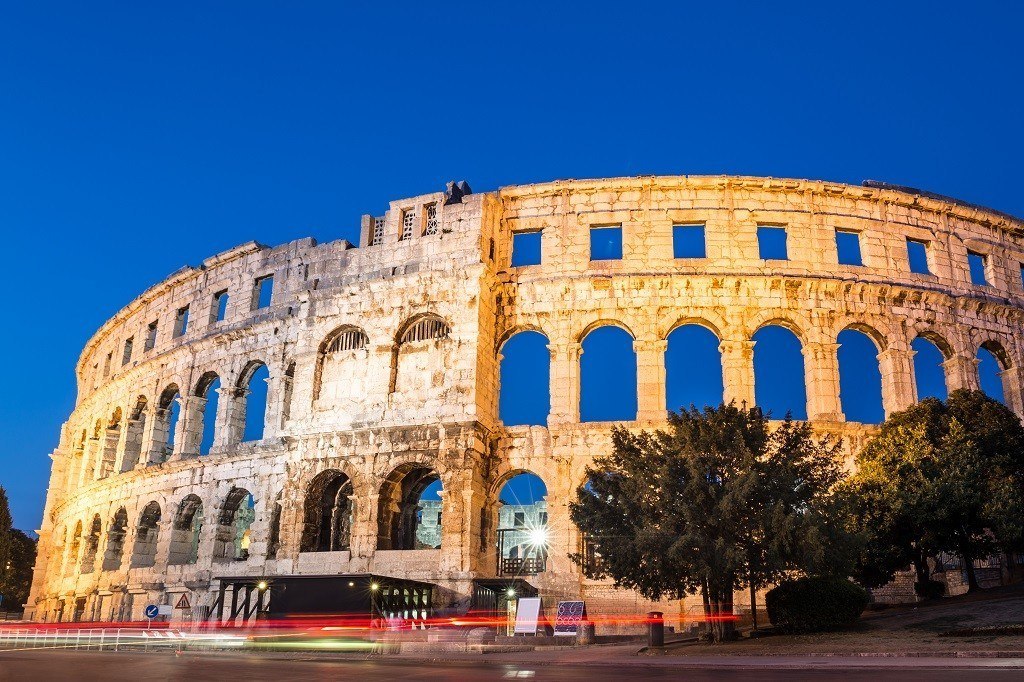 The Roman Amphitheater of Pula, Croatia shot at dusk. It was constructed in 27 - 68 AD and is among the six largest surviving Roman arenas in the World and best preserved ancient monument in Croatia.